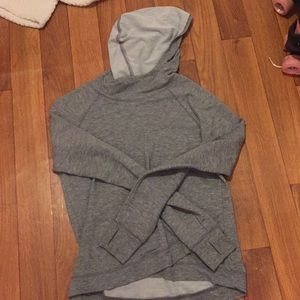 Gray sweatshirt,has thumb holes,crossed bottom